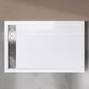 A top-down view of a white rectangular shower tray with a silver drain cover. Produktbild-Vorschau