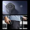 A person is putting a wireless charger into their pocket, and a close-up of the charger is shown. Produktbild-Vorschau