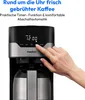 A hand is shown pressing a button on a coffee maker with a digital display. Produktbild-Vorschau