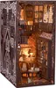 A miniature, detailed model of a room inside a book nook, designed to look like a castle library. Voir les images du produit