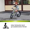 A young girl riding a bicycle outdoors. Produktbild-Vorschau