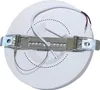 The back of a white LED downlight with mounting hardware and wires. Produktbild-Vorschau