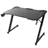 A black gaming desk with a Z-shaped frame, a cup holder, and a headphone holder, shown from a three-quarter angle against a white background. Anteprima dell’immagine prodotto