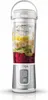 A portable blender filled with fruit and ice, with its base attached. Podgląd zdjęcia produktu