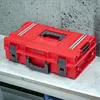 A red tool case is placed on a workbench. Anteprima dell’immagine prodotto
