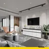 A modern living room with a TV, sideboard, armchair, and coffee table. Voir les images du produit
