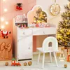 A child's vanity set with a chair, decorated for Christmas. Voir les images du produit