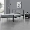 A bedroom scene with a bed, nightstand, and artwork. Produktbild-Vorschau