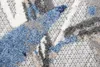 A close-up view of a rug with a modern abstract pattern in shades of blue, gray, and cream. Náhľad obrázku produktu