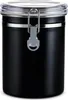 A black metal coffee canister with a clear lid and a silver clasp. Podgląd zdjęcia produktu