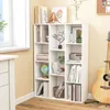 A white bookshelf filled with books and decorative items, placed next to a window. Podgląd zdjęcia produktu