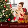 A mother and daughter decorating a Christmas tree with LED candles, with a dog nearby. Produktbild-Vorschau
