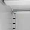 A close-up view of the interior corner of a metal cabinet, showing shelf support brackets. Produktbild-Vorschau