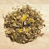 A pile of granola or animal feed is spread out on a wooden surface. Produktbild-Vorschau