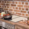 A kitchen counter with a stovetop, cookware, and ingredients. Náhled obrázku produktu