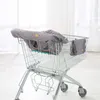 A shopping cart with a gray cover and a gray bag hanging on the side. Anteprima dell’immagine prodotto