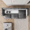 A top-down view of a modern living room setup, featuring a sectional sofa, coffee table, and a textured rug. Produktbild-Vorschau