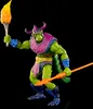 A green, reptilian-looking action figure with purple armor and a helmet, holding a torch in one hand and a spear in the other, against a black background. Náhled obrázku produktu