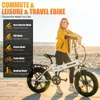 A woman stands with an e-bike on a beach. Produktbild-Vorschau