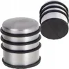 Two door stoppers are shown against a white background. One is in the foreground, and another is slightly behind and to the right. Náhled obrázku produktu