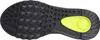 The sole of a black sneaker with a neon yellow accent. Podgląd zdjęcia produktu