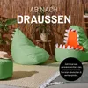 Two green beanbag chairs shaped like monsters are placed on a rug in front of a bamboo wall. One chair is a dinosaur shape, and the other is an alligator shape with an orange stuffed toy inside its mouth. A small green ottoman is in the foreground. Anteprima dell’immagine prodotto