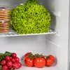 Inside a refrigerator, showing fresh produce on shelves. Voir les images du produit