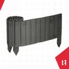 A dark gray wooden garden border, partially unrolled, with pointed stakes for insertion into the ground. Náhled obrázku produktu