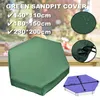 A green sandpit cover is shown in the foreground, with a baby partially visible behind it. Insets show water droplets on the cover and a drawstring closure. A diagram of a hexagonal sandpit with dimensions is in the bottom right. Podgląd zdjęcia produktu