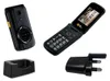 A collection of a flip phone, its charger, and charging cradle, all presented on a white background. Produktbild-Vorschau