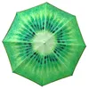 A top-down view of an open umbrella with a kiwi fruit pattern. Voir les images du produit