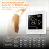 A woman stretching in front of a smart thermostat displaying temperature settings and a weekly program schedule. Anteprima dell’immagine prodotto