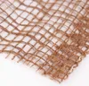 A close-up view of a woven jute fabric with a grid pattern. Anteprima dell’immagine prodotto