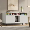 A white sideboard with open shelves and a hidden compartment for a litter box, styled in a modern living room setting. Anteprima dell’immagine prodotto