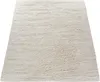 A fluffy, beige rug is shown from a diagonal, slightly elevated angle against a white background. Produktbild-Vorschau
