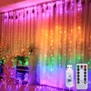 A room decorated with colorful LED curtain lights, furniture, and plants. Produktbild-Vorschau