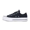 A side view of a black Converse platform sneaker with a white sole, set against a white background. Voir les images du produit