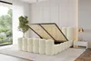 A bedroom with a bed that has its storage compartment open. Produktbild-Vorschau