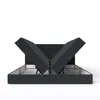 A dark gray upholstered bed frame with its storage compartments open, revealing the interior. Náhled obrázku produktu