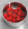 A stainless steel colander filled with red tomatoes, sitting in water on a countertop. Náhled obrázku produktu