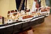 Close-up of a Lego model ship, showing details of the deck and lifeboats. Voir les images du produit
