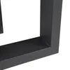 A close-up view of the corner of a black metal table leg frame, showing the joinery and texture of the material. Anteprima dell’immagine prodotto