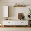 A modern living room setup featuring a wall-mounted cabinet and a long media console. Produktbild-Vorschau