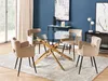 A round glass dining table with a gold metal base and four beige upholstered chairs in a dining room setting. Náhľad obrázku produktu