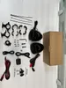 A flat lay of motorcycle speakers and accessories, including mounting hardware, cables, and a user manual, laid out on a white surface. Náhled obrázku produktu