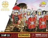 A group of toy Roman soldiers standing on a cobblestone path with a sunset sky in the background. Produktbild-Vorschau