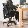 A person sitting at a desk in a home office. Produktbild-Vorschau