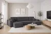 A modern living room with a large sectional sofa, coffee table, and TV stand. Náhled obrázku produktu