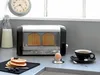 A kitchen counter with a toaster, coffee, and pancakes. Podgląd zdjęcia produktu