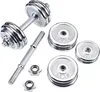 A set of chrome dumbbells and weight plates are arranged on a white background. Produktbild-Vorschau